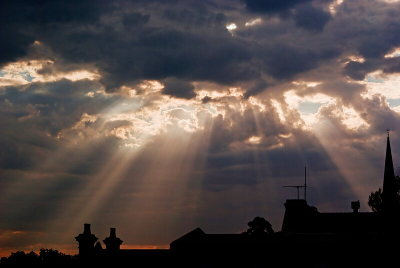 Sunlight Through Clouds — Gray, Dramatic, Sunset, Photograph, Buildings