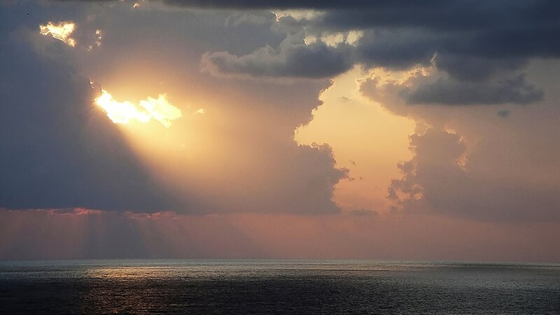 Sunlight Through Clouds — Orange, Dramatic, Sunset, Photograph, Ocean, Sun