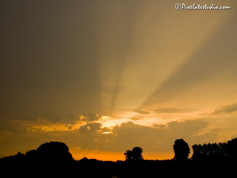 Sunlight Through Clouds — Orange, Dramatic, Sunset, Photograph, Trees, Sky, Yellow