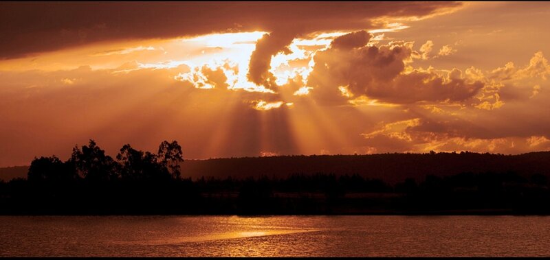 Sunlight Through Clouds — Orange, Dramatic, Sunset, Photograph, Water