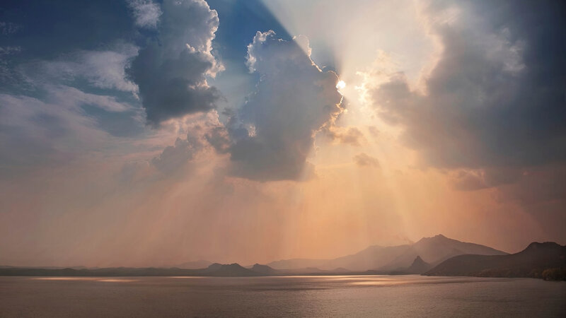 Sunlight Through Clouds over Lake — Blue