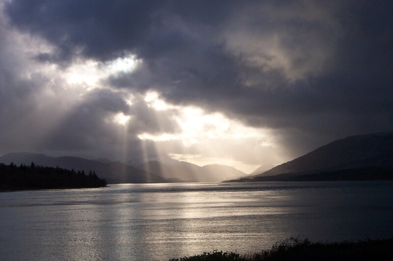 Sunlight Through Clouds over Lake — Gray, Dramatic