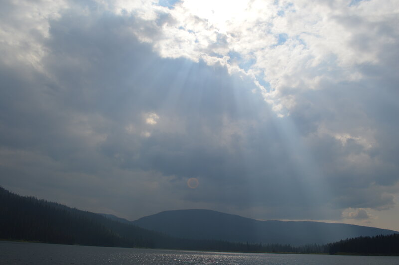 Sunlight Through Clouds over Lake — Gray