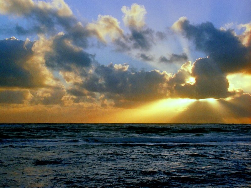 Sunlight Through Clouds over Ocean — Blue, Dramatic, Sunset, Photograph, Yellow