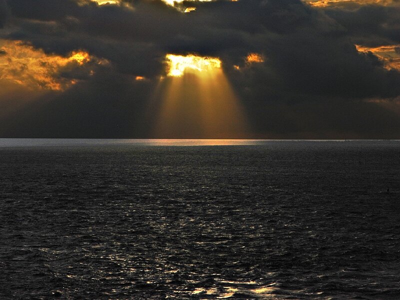 Sunlight Through Clouds over Sea — Black