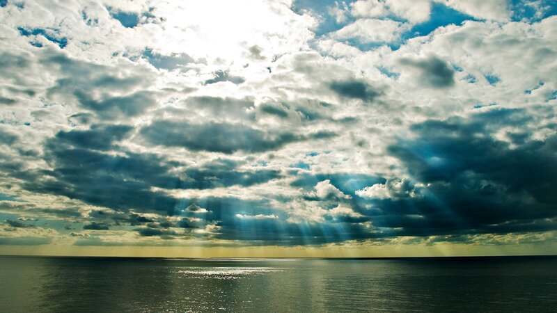Sunlight Through Clouds over Sea — Blue, Dramatic, Sunset, Photograph, Sunbeams, White