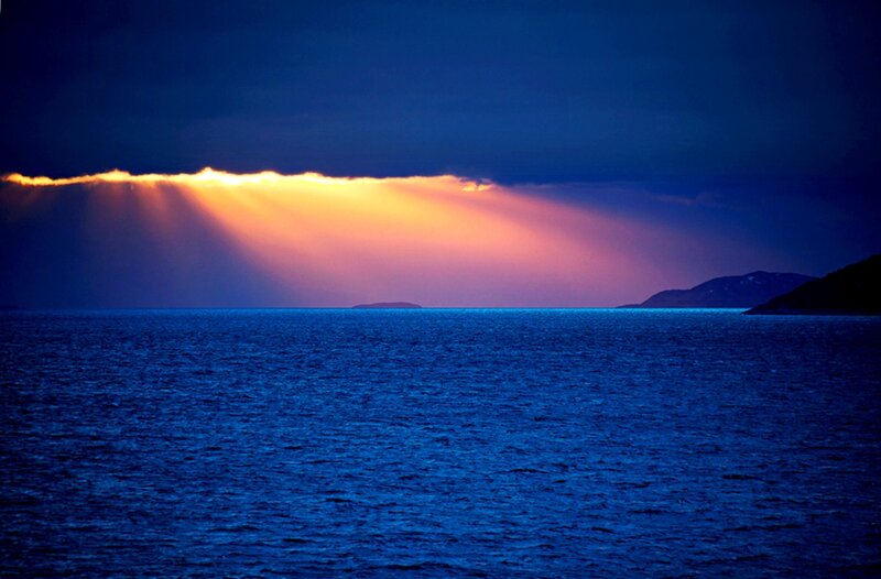 Sunlight Through Clouds over Sea — Blue, Dramatic, Sunset