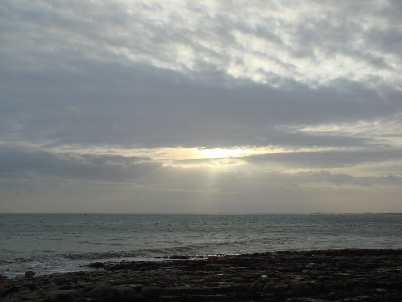 Sunlight Through Clouds over Sea — Gray, Calm