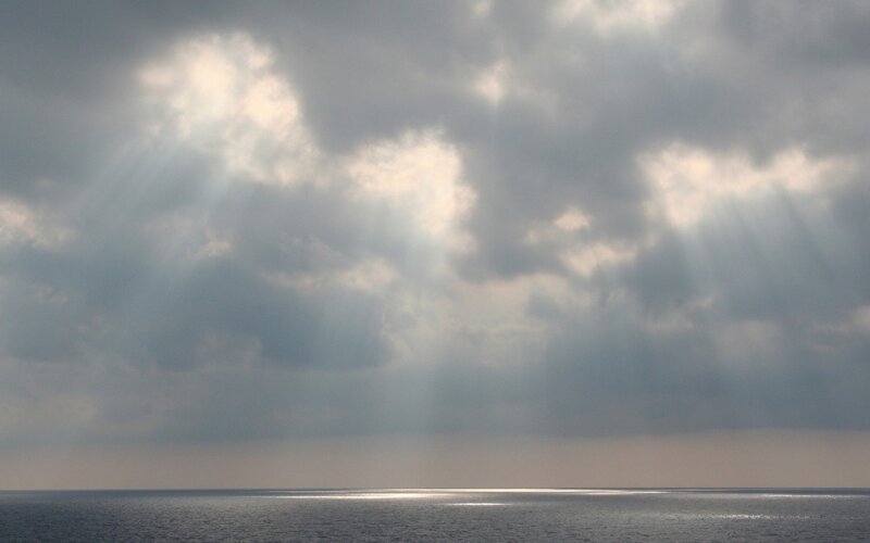 Sunlight Through Clouds over Sea — Gray, Dramatic, Photograph, Sunbeams, Blue