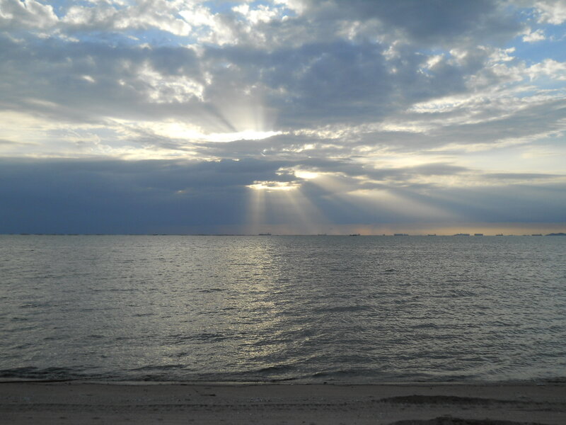Sunlight Through Clouds over Sea — Gray, Dramatic, Sunrise, Photograph
