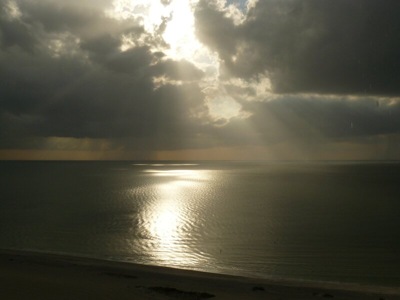 Sunlight Through Clouds over Sea — Gray, Dramatic, Sunrise