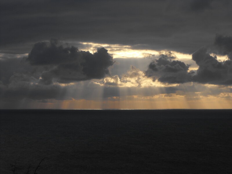 Sunlight Through Clouds over Sea — Gray, Dramatic