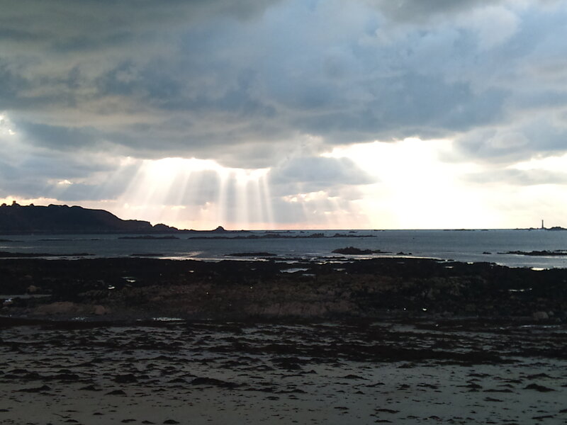 Sunlight Through Clouds over Sea — Gray