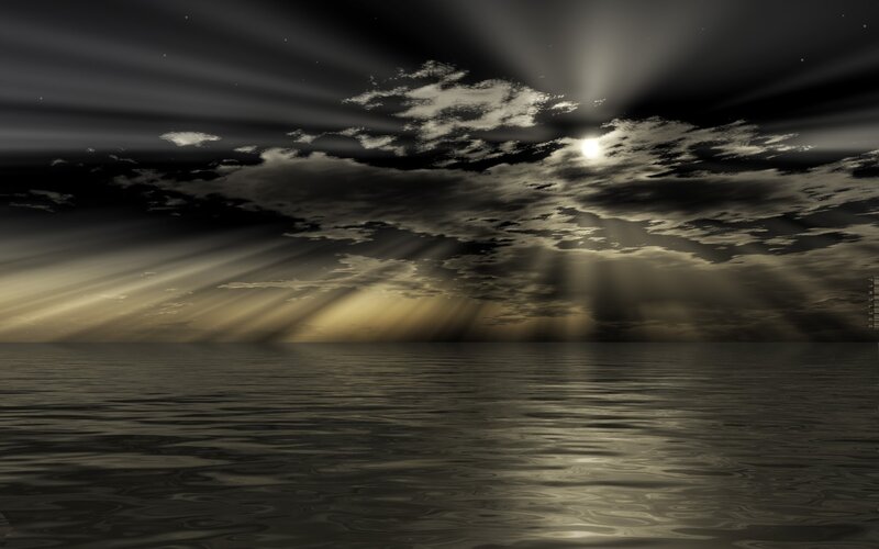 Sunlight through clouds over water