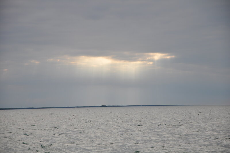 Sunlight Through Clouds over Water — Gray, Serene