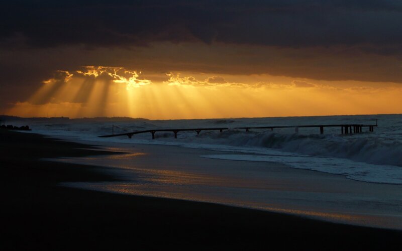 Sunlight Through Clouds — Yellow, Dramatic, Sunset, Photograph, Beach, Pier, Waves