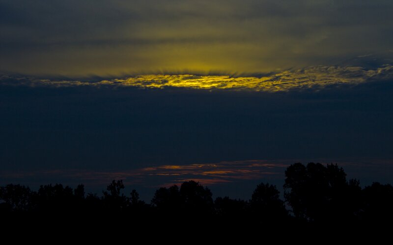 Sunlight Through Clouds — Yellow, Dramatic, Sunset, Photograph, Trees, Dark Blue