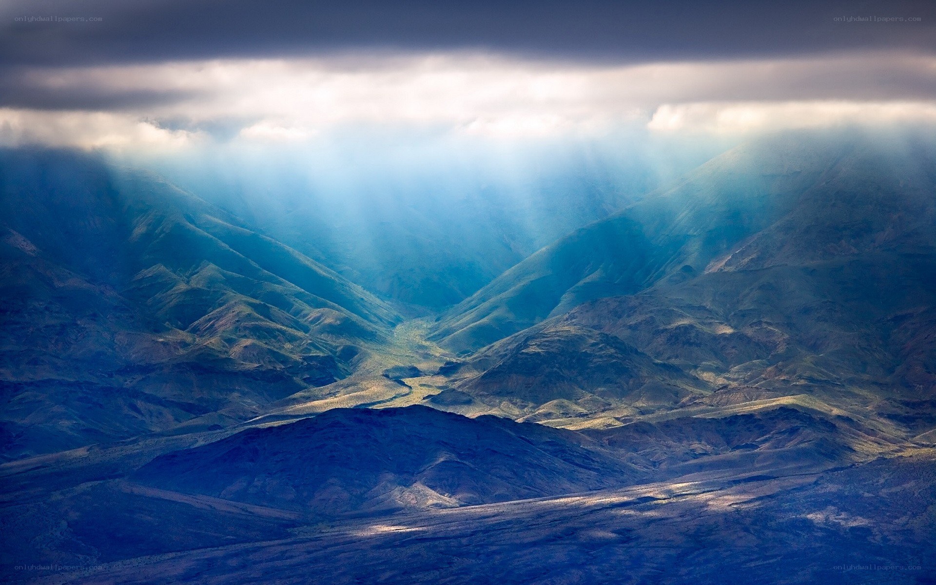 Sunlight through mountain clouds
