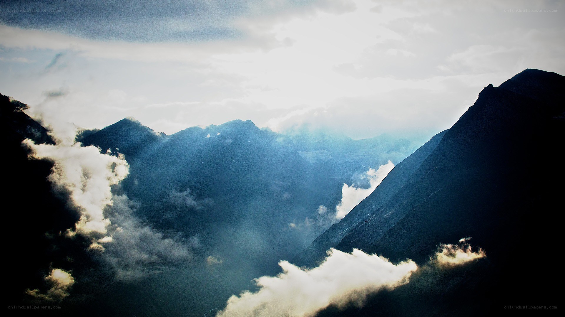 Sunlight through mountain clouds