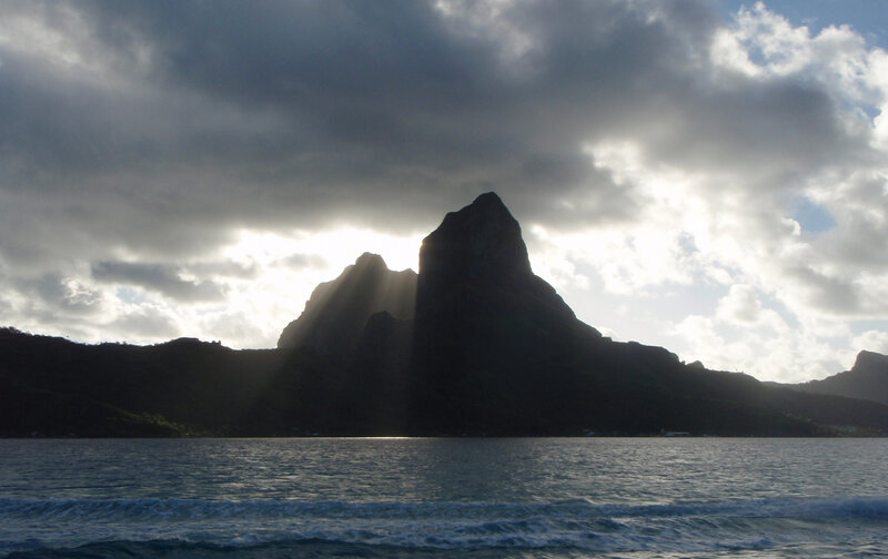 Sunlight through mountain peaks