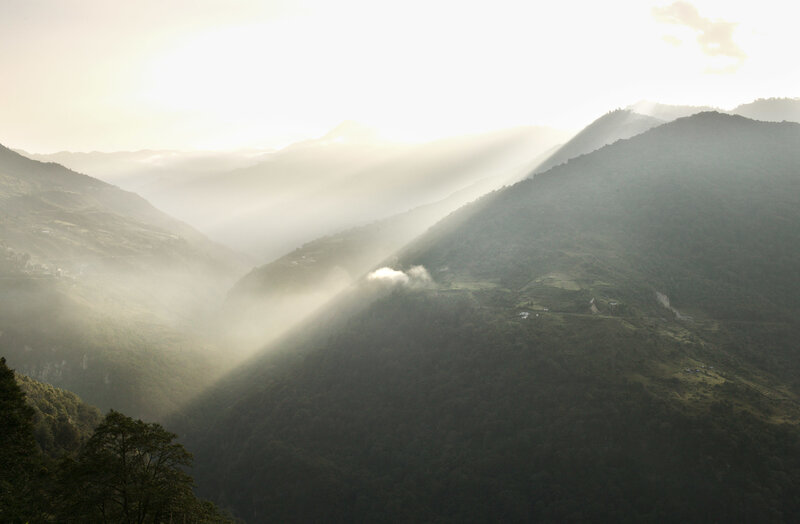 Sunlight through mountain valley