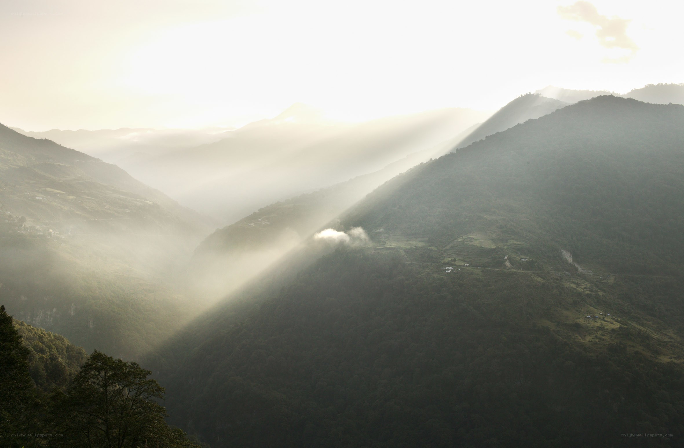 Sunlight through mountain valley
