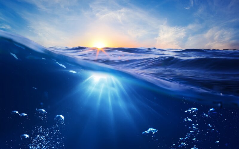 Sunlight Through Ocean Surface — Blue, Serene, Sunset