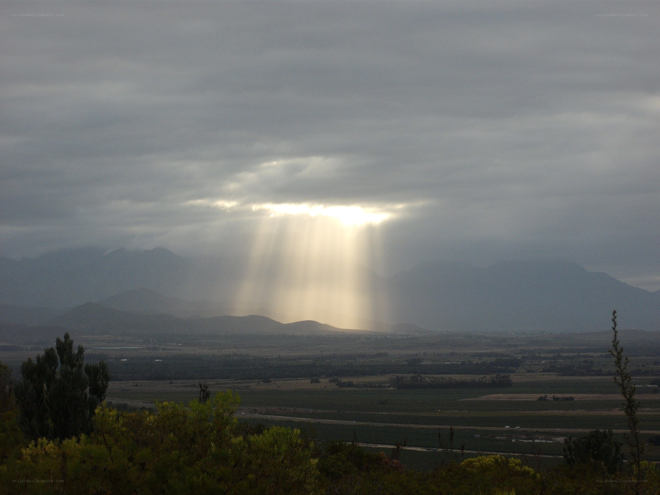 sunlight through storm clouds