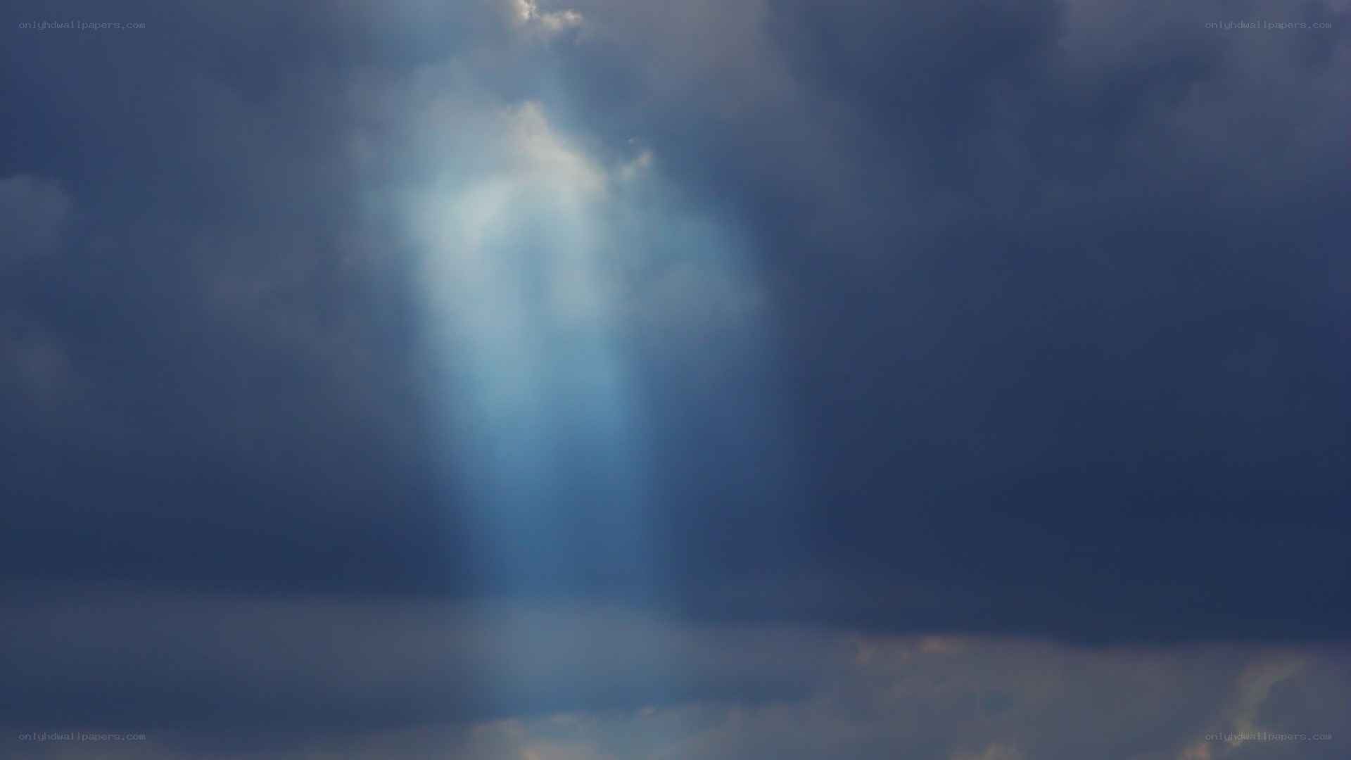 sunlight through storm clouds
