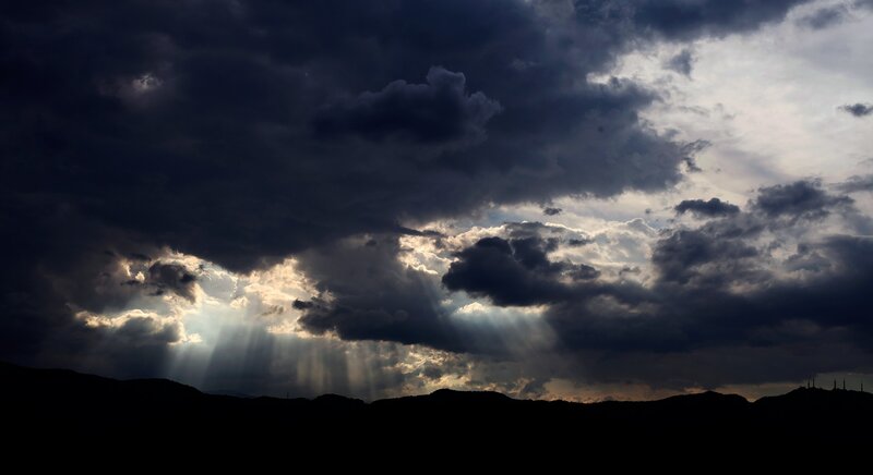 Sunlight Through Storm Clouds — Black, Dramatic, Sunset, Photograph, Mountains