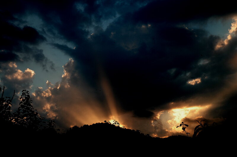 Sunlight Through Storm Clouds — Black, Dramatic, Sunset, Photograph