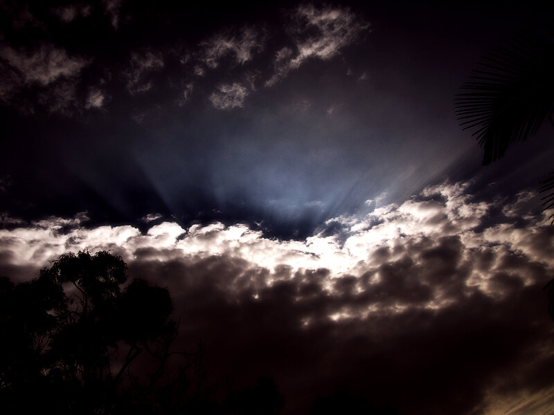 Sunlight Through Storm Clouds — Black, Dramatic
