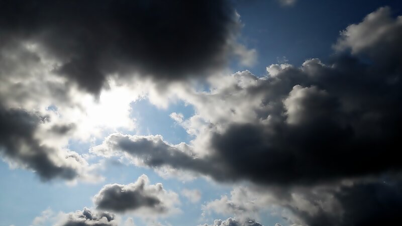 Sunlight Through Storm Clouds — Blue, Dramatic, Afternoon