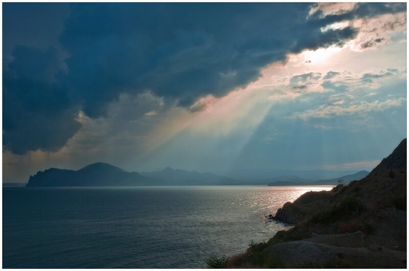 Sunlight Through Storm Clouds — Blue, Dramatic, Sunset, Photograph, Sea