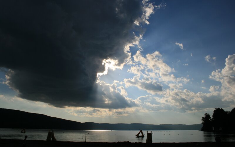 Sunlight Through Storm Clouds — Blue, Dramatic