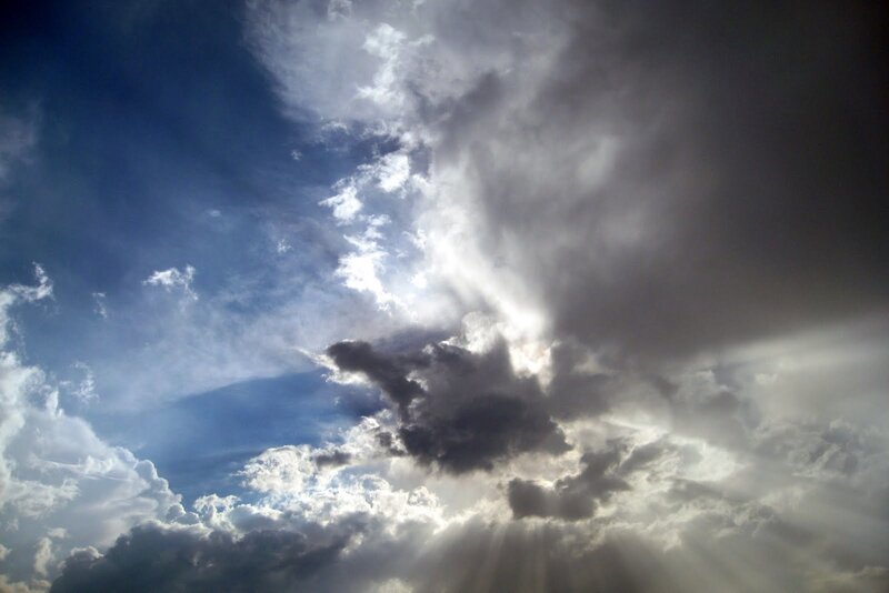 Sunlight Through Storm Clouds — Blue