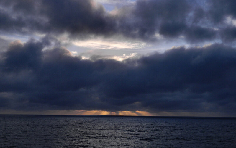 Sunlight Through Storm Clouds — Dark Blue