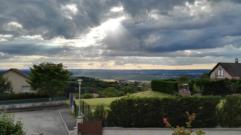 Sunlight Through Storm Clouds — Gray, Dramatic, Afternoon, Photograph