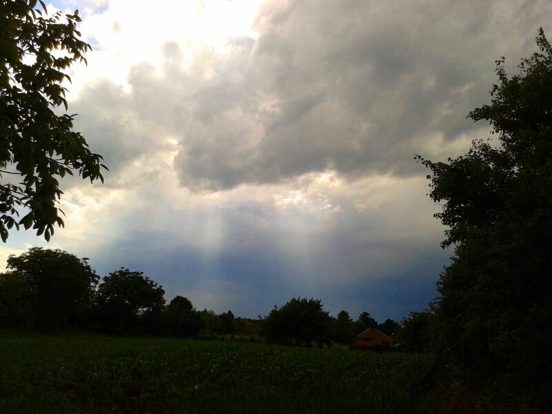 Sunlight Through Storm Clouds — Gray, Dramatic, Afternoon