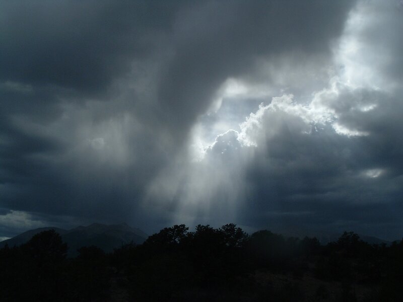 Sunlight Through Storm Clouds — Gray, Dramatic, Photograph, Mountains, Trees