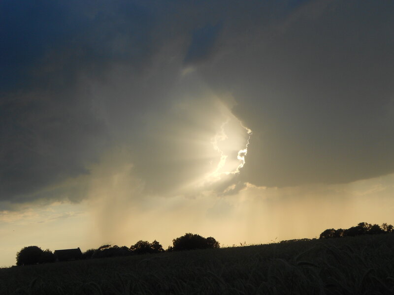Sunlight Through Storm Clouds — Gray, Dramatic, Sunset, Photograph, Field