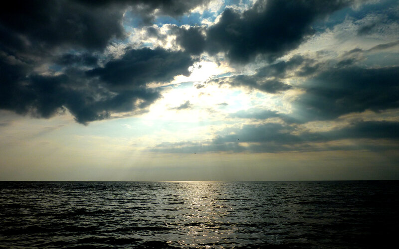 Sunlight Through Storm Clouds — Gray, Dramatic, Sunset, Photograph, Sea, Blue