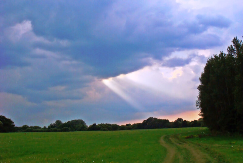 Sunlight Through Storm Clouds — Green, Dramatic