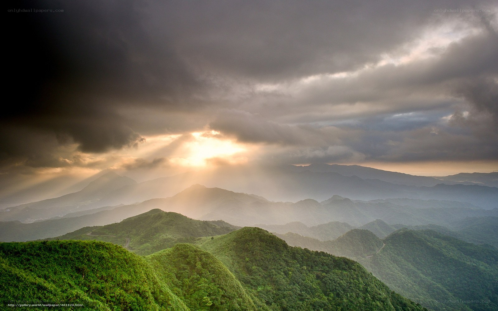 Sunlight through stormy mountains
