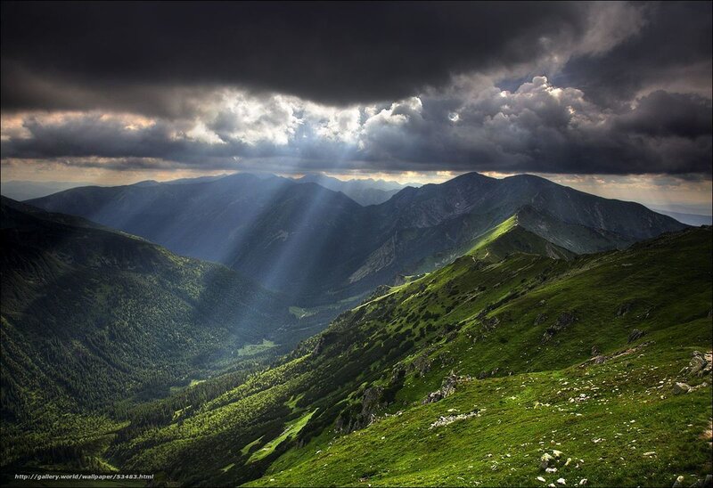 Sunlight through stormy mountains
