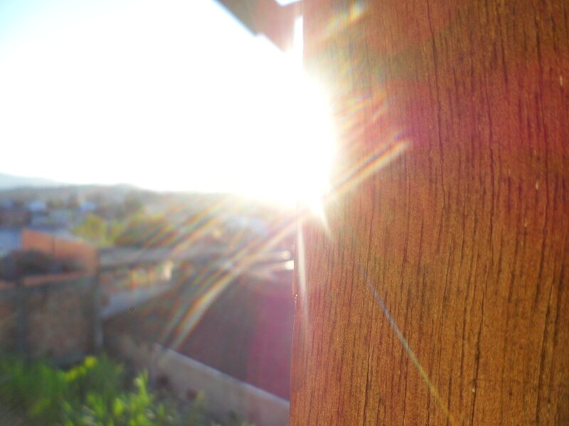Sunlight through wooden post