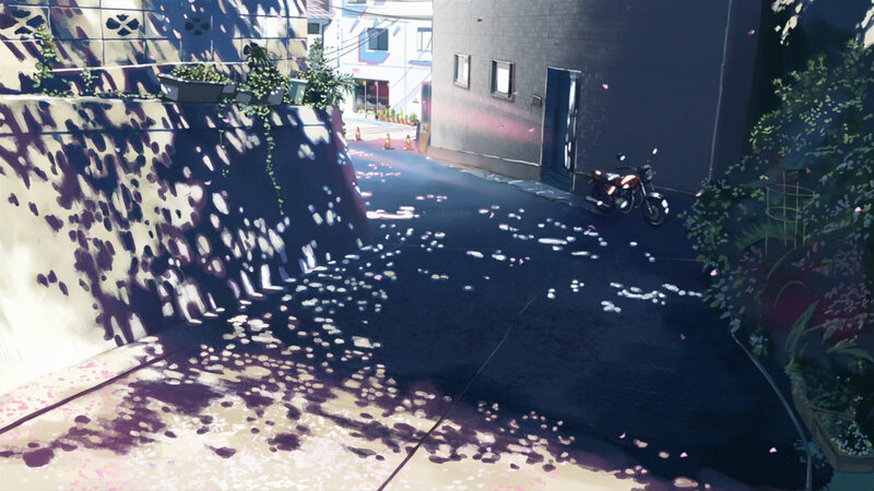 Sunlit alley with motorcycle