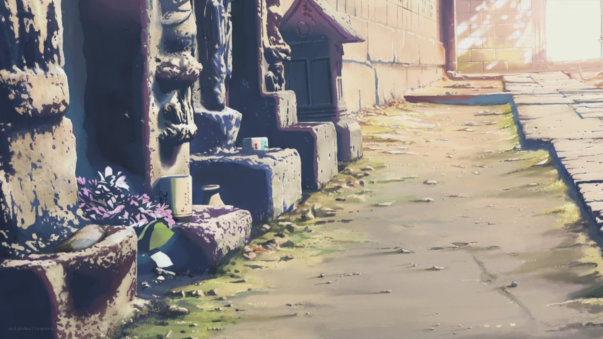 Sunlit alley with stone statues