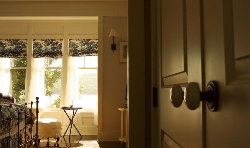 sunlit bedroom with patterned curtains