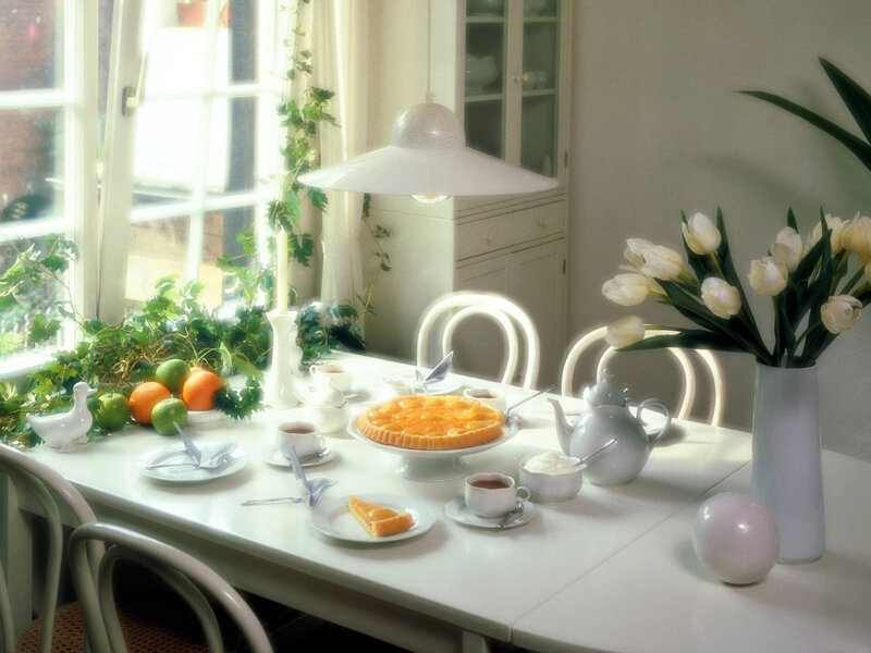 Sunlit breakfast table with pie